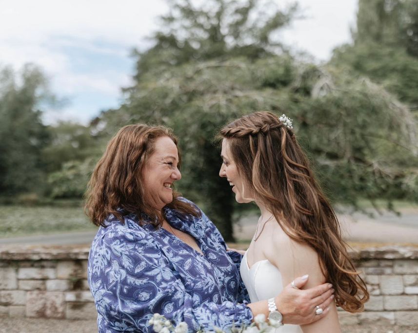 Sara Cumming welcoming a Bride with a hug and a smile