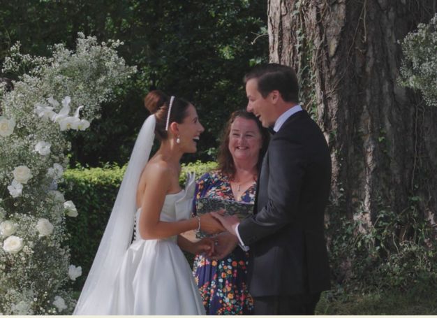 Bridge and Groom exchanging vows, holding hands